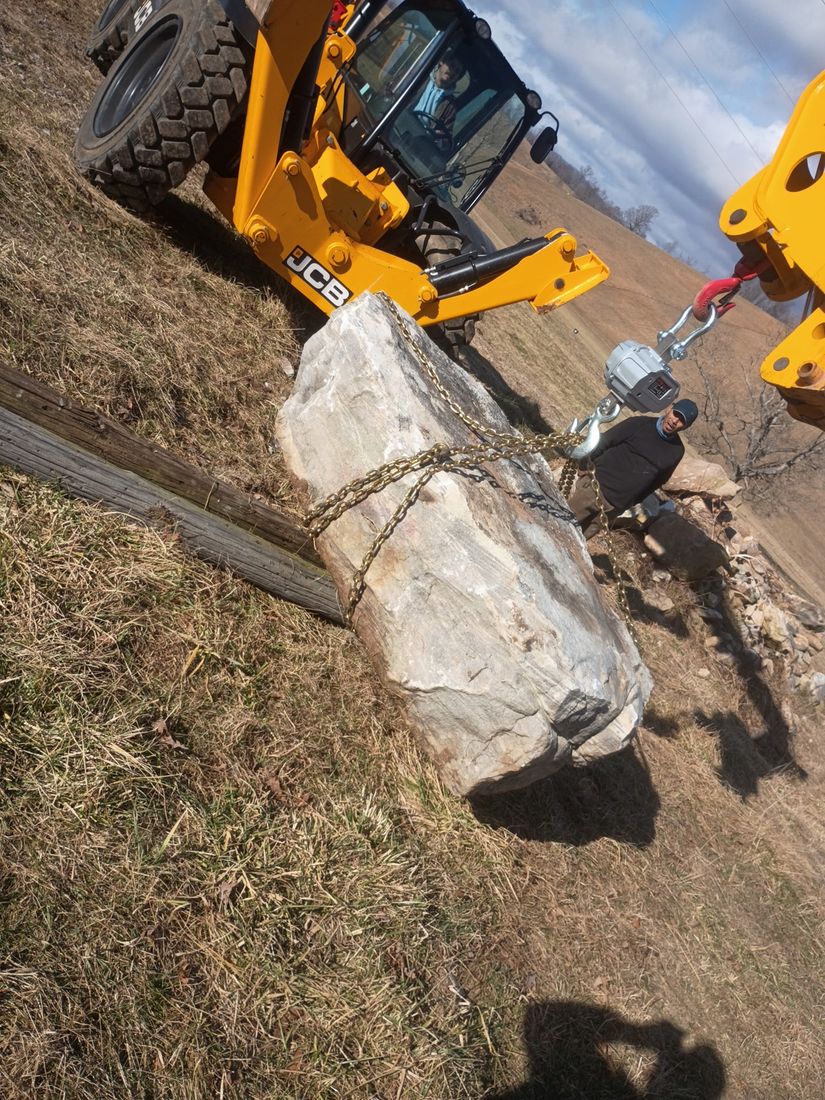 Loading a boulder for delivery