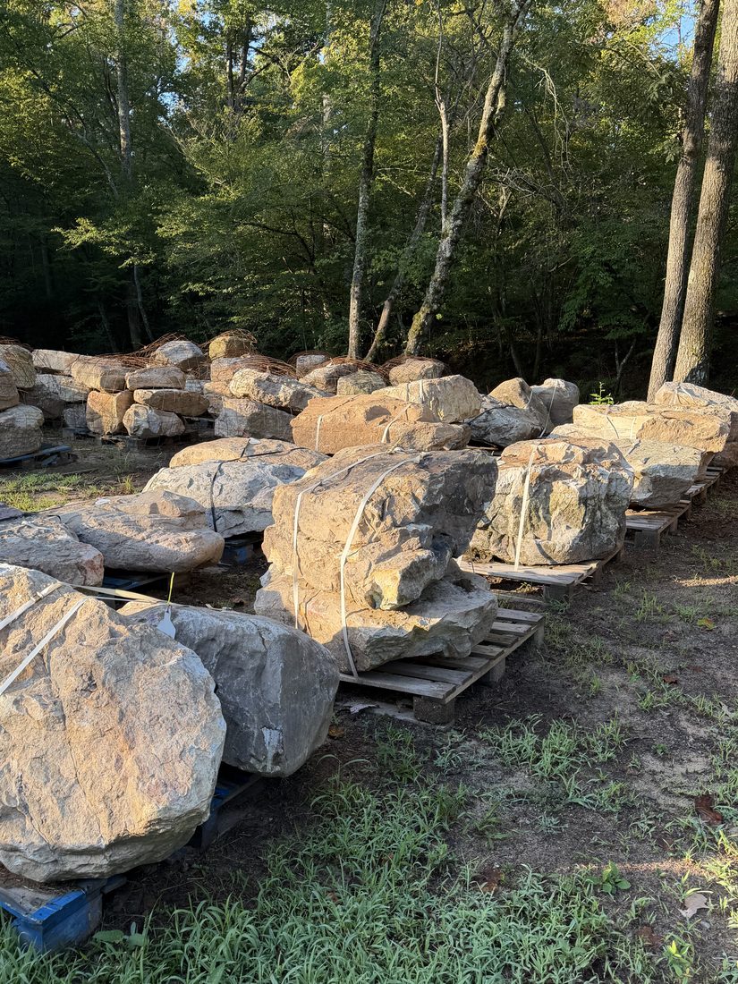 Boulders on pallets in morning light